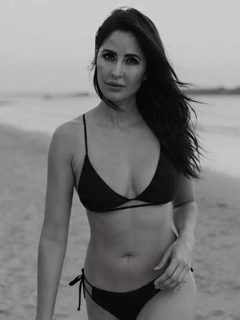 Confident beach pose reflects Katrina's comfort with swimwear styling
