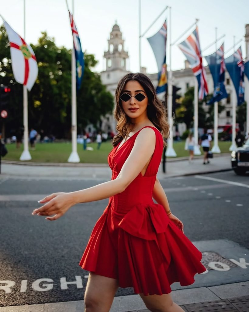 Powerful red ensemble creates dramatic impact in Lakshmi's professional photography