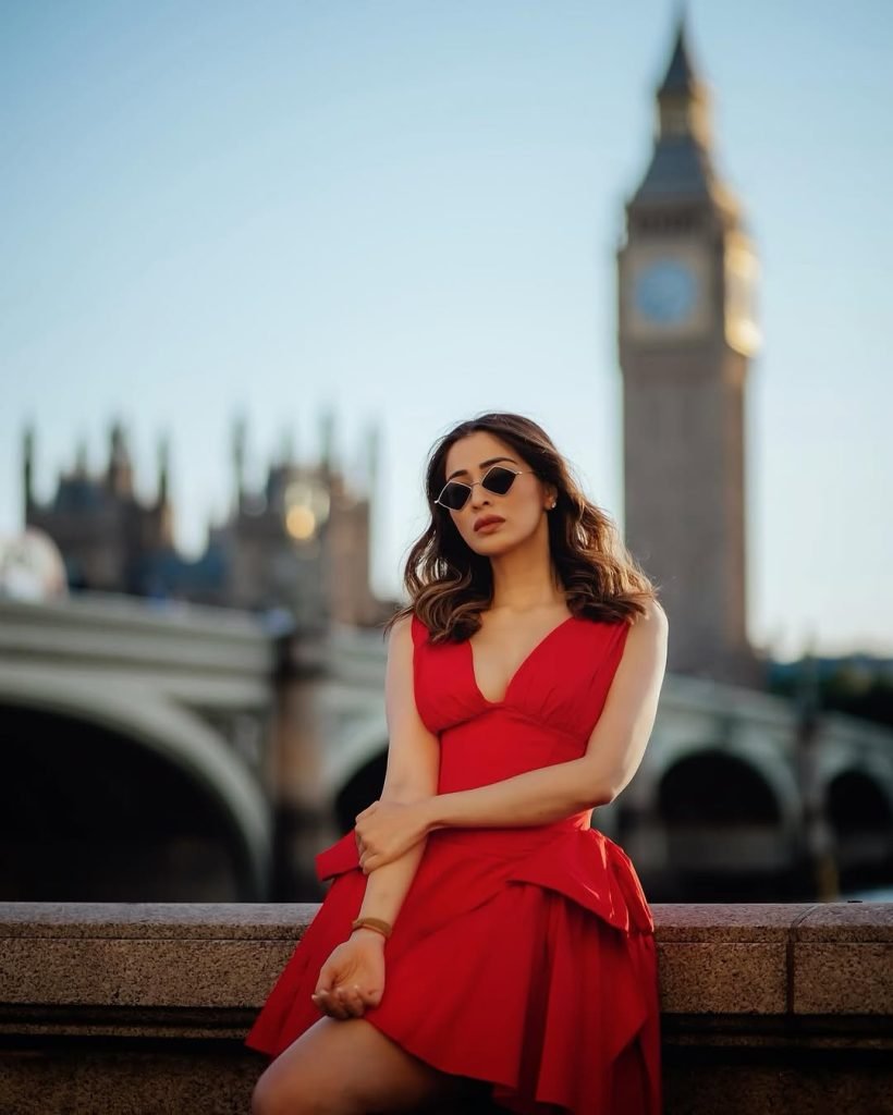 Striking red dress commands attention in Lakshmi's glamorous photoshoot setting