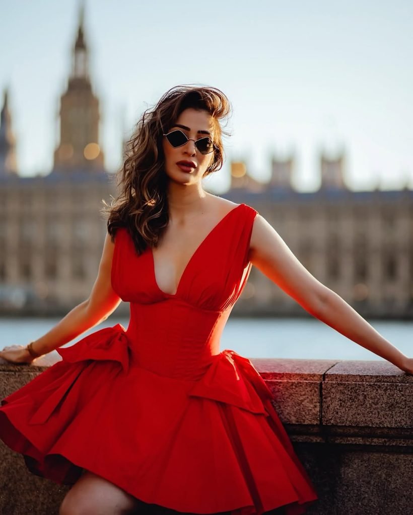 Bold red color choice demonstrates Lakshmi's confident fashion sense