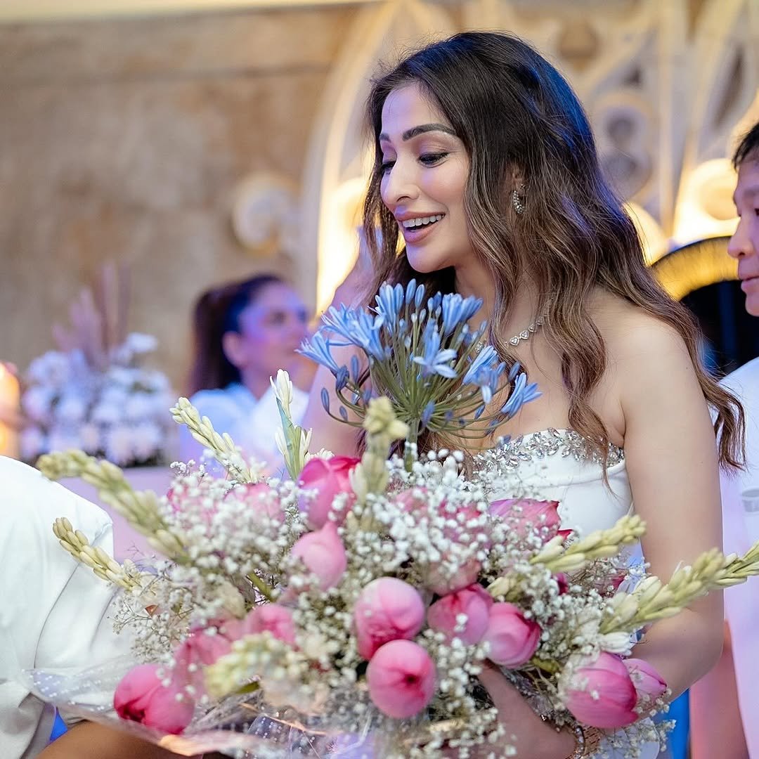 Joyful expression complements Lakshmi's birthday frock's celebratory styling