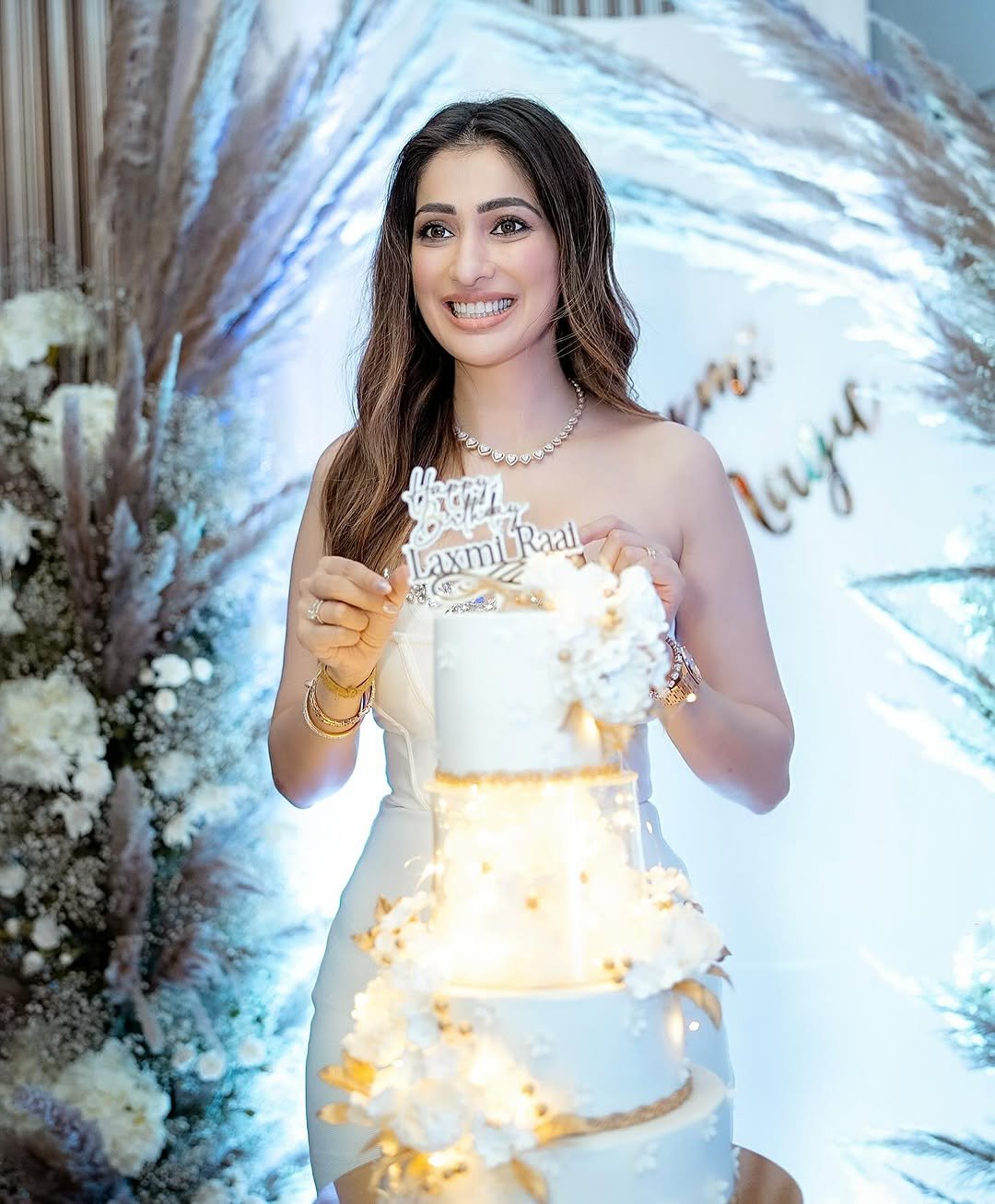 Joyful expression complements Lakshmi's birthday frock's celebratory styling