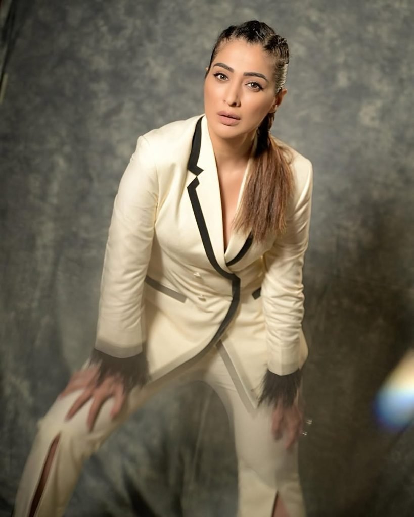 Sophisticated white dress epitomizes timeless elegance and grace for Lakshmi