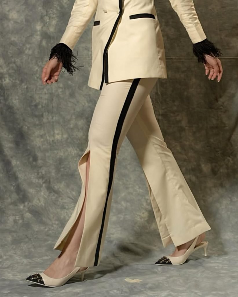 Classic white styling demonstrates Lakshmi's fashion expertise