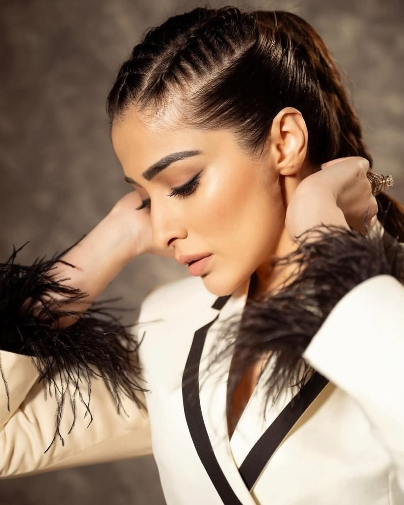 Sophisticated white dress epitomizes timeless elegance and grace for Lakshmi