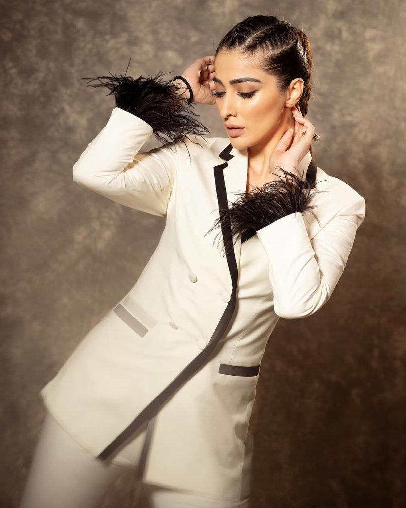 Sophisticated white dress epitomizes timeless elegance and grace for Lakshmi