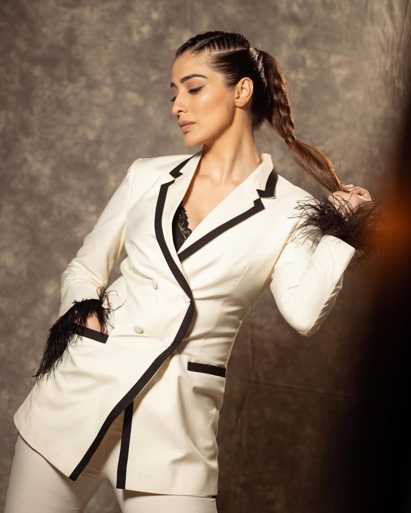 Sophisticated white dress epitomizes timeless elegance and grace for Lakshmi