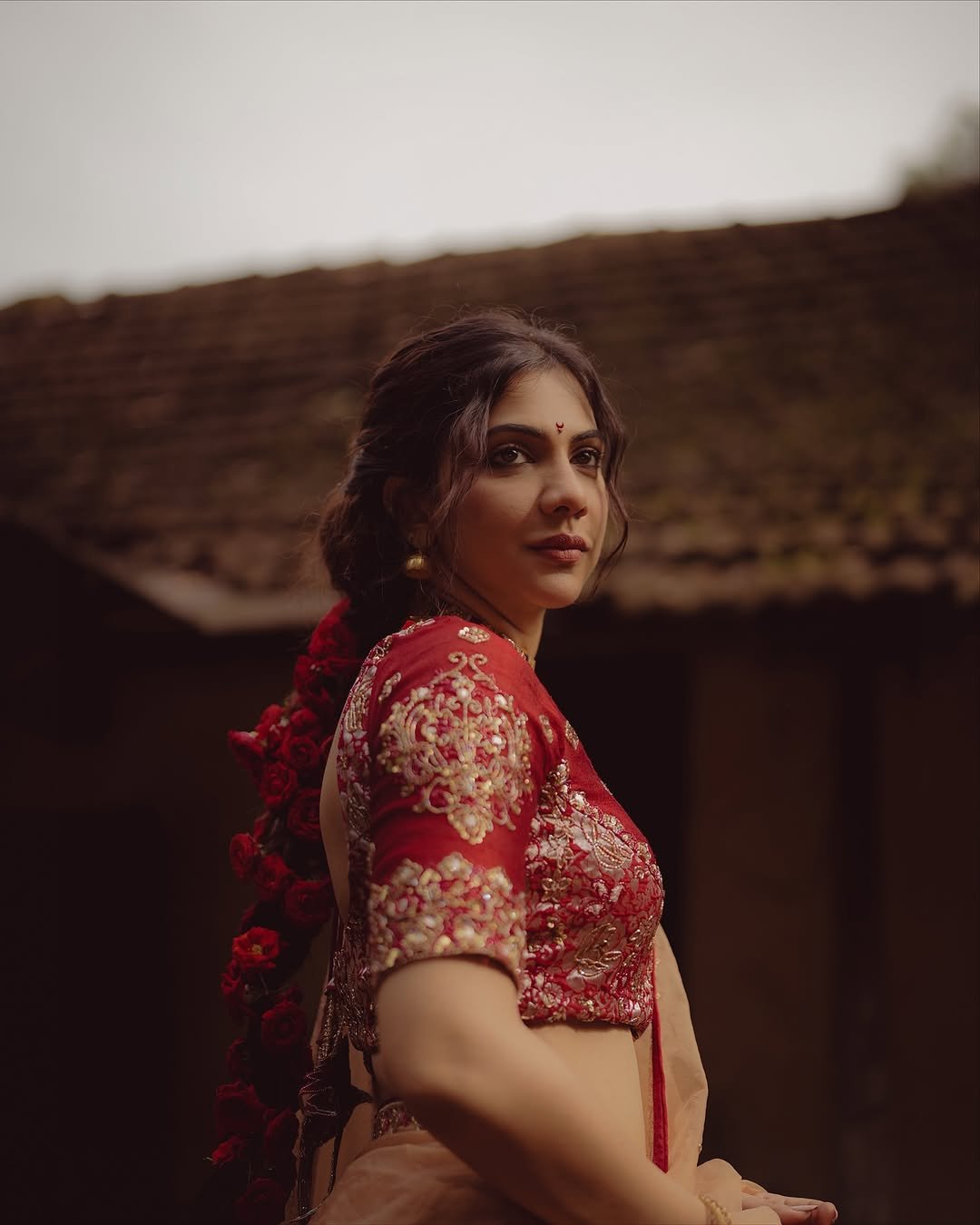 Madonna Sebastian in traditional red bridal attire with statement gold jewelry (11)