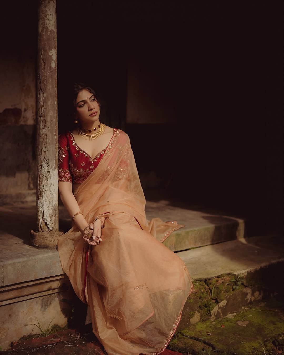 Madonna Sebastian in traditional red bridal attire with statement gold jewelry (16)