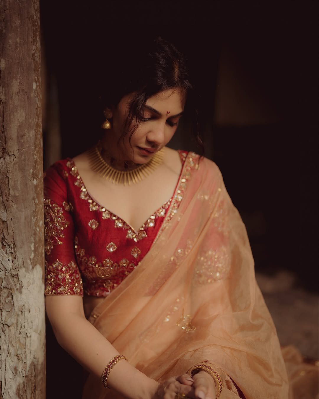 Madonna Sebastian in traditional red bridal attire with statement gold jewelry (3)