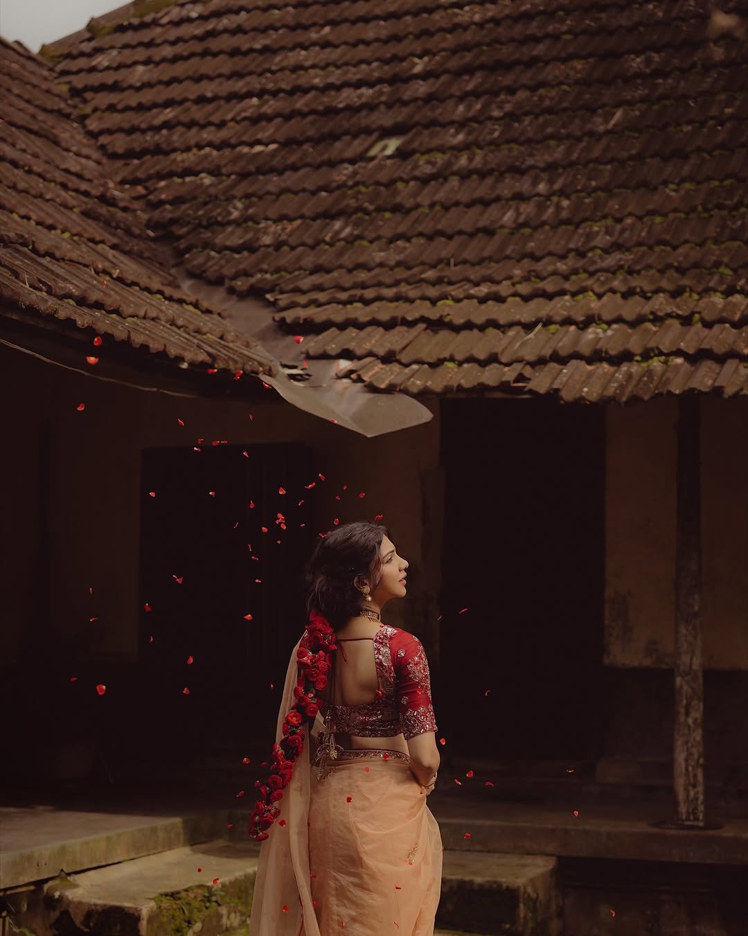 Madonna Sebastian in traditional red bridal attire with statement gold jewelry (4)