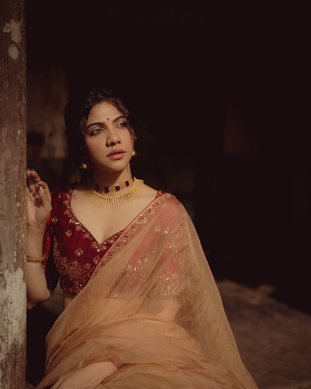 Madonna Sebastian in traditional red bridal attire with statement gold jewelry (7)