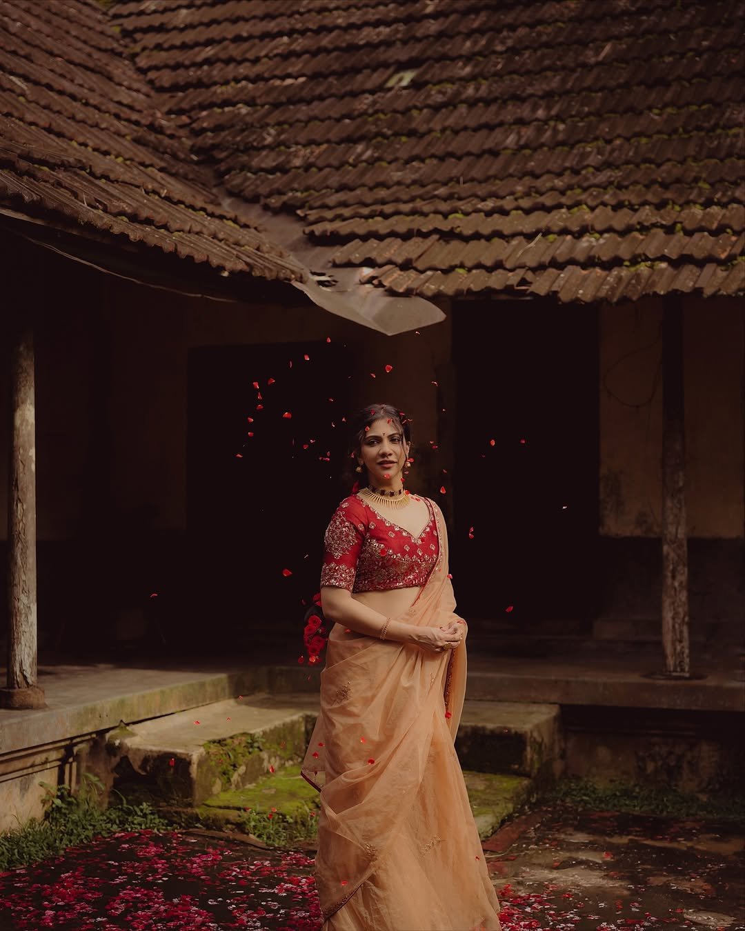 Madonna Sebastian in traditional red bridal attire with statement gold jewelry (9)