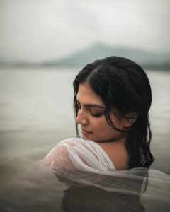 Breathtaking river setting enhances Malavika's wet white saree photography