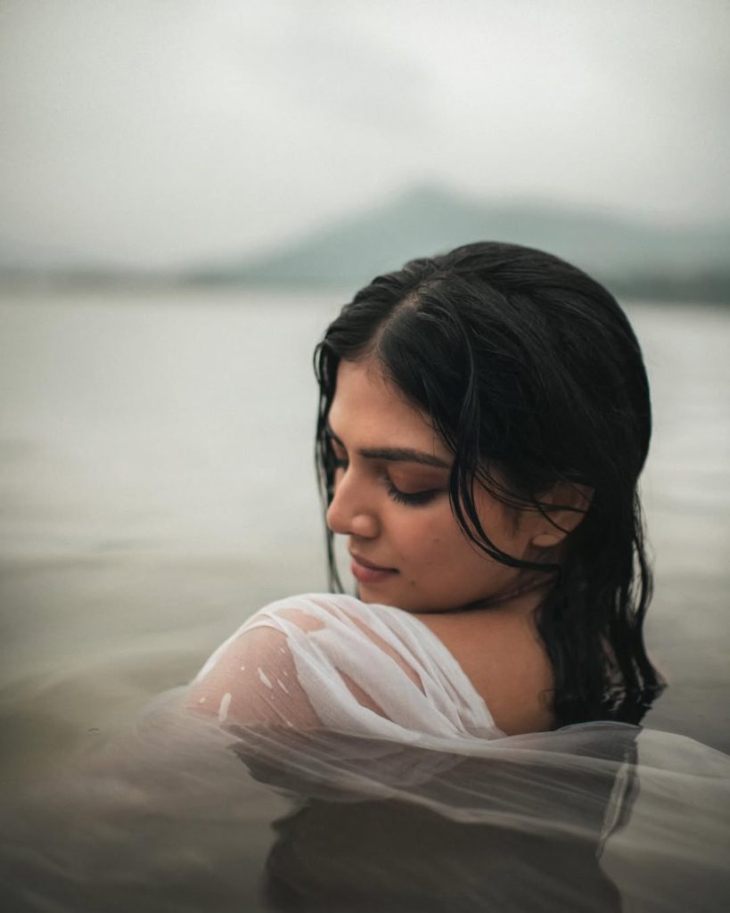 Breathtaking river setting enhances Malavika's wet white saree photography