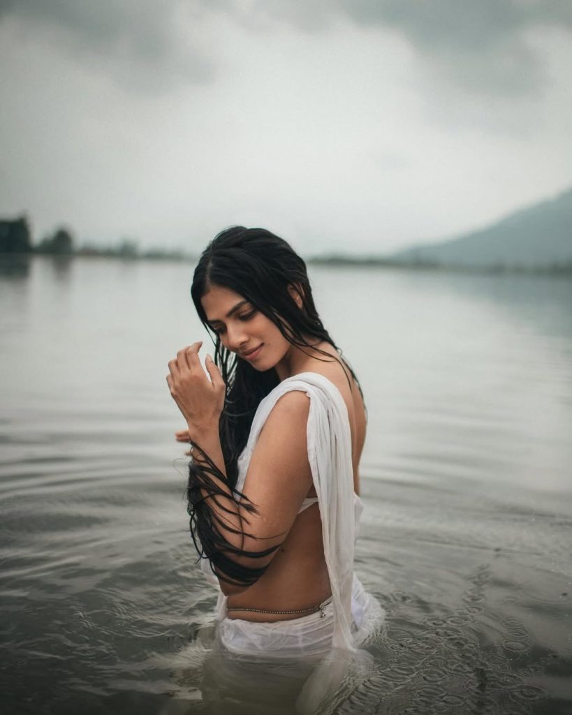 Breathtaking river setting enhances Malavika's wet white saree photography