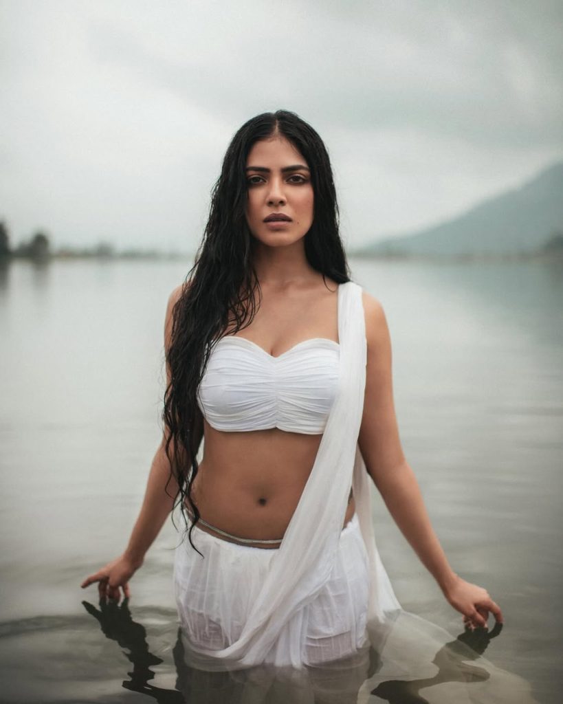 Breathtaking river setting enhances Malavika's wet white saree photography