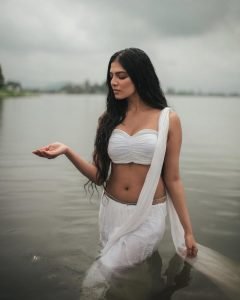 Breathtaking river setting enhances Malavika's wet white saree photography