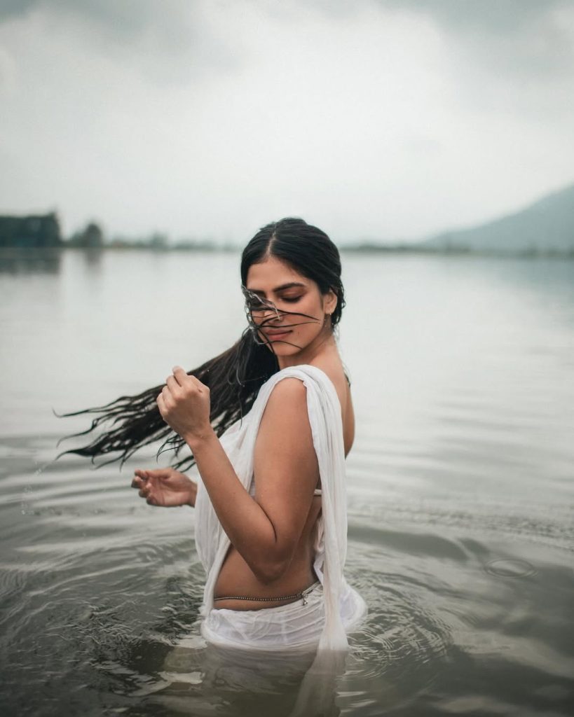 Breathtaking river setting enhances Malavika's wet white saree photography
