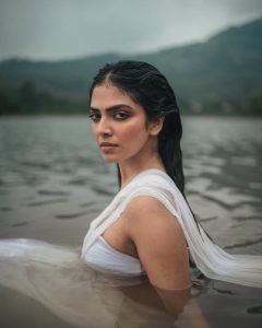 Riverside photoshoot captures Malavika's ethereal wet saree presentation