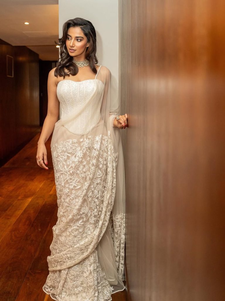 Meenakshi Chaudhary embodies timeless elegance in pristine white ensemble