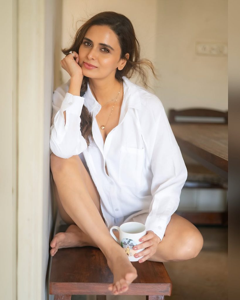 Crisp white shirt creates professional yet relaxed styling statement for Meenakshi Dixit