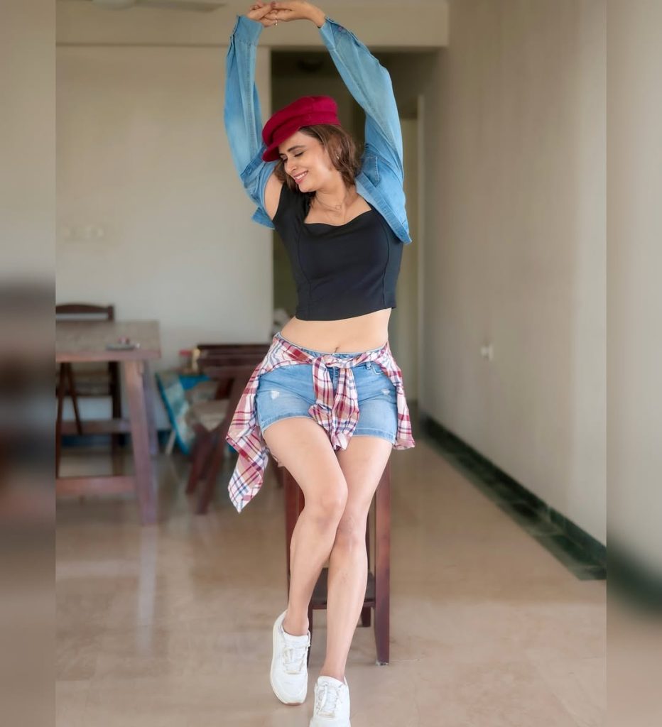 Contemporary shorts dress styling reflects Meenakshi Dixit's modern fashion sensibilities