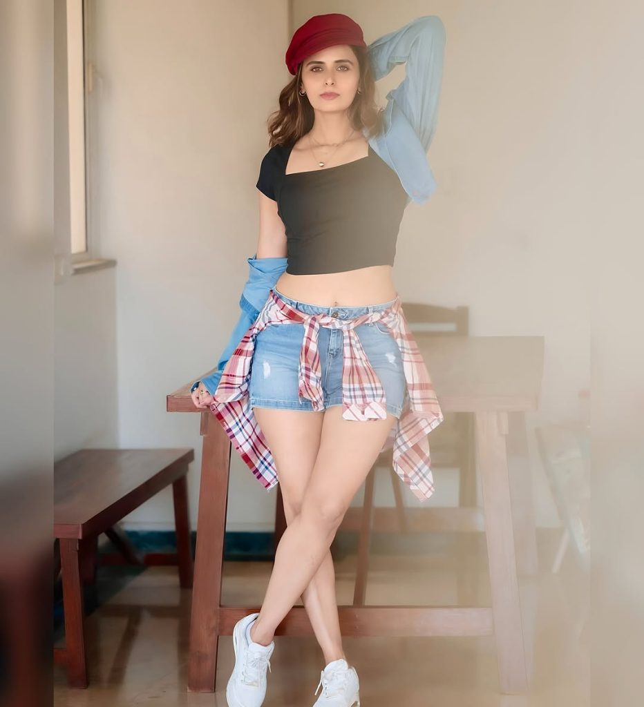 Contemporary shorts dress styling reflects Meenakshi Dixit's modern fashion sensibilities