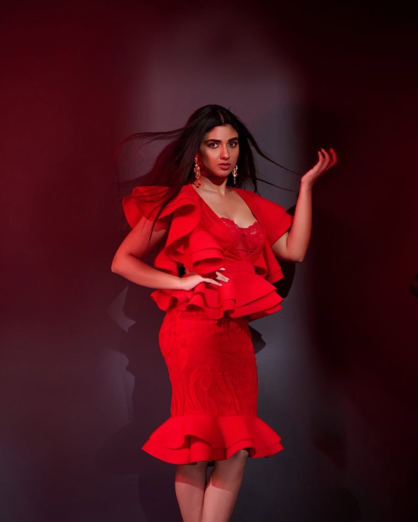 Red fabric catches light beautifully in Pragya Nagra's fashion portrait