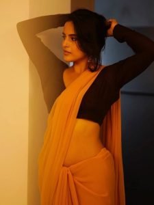 Pratiba Chaudhary embodies elegance in yellow saree with complementary brown blouse