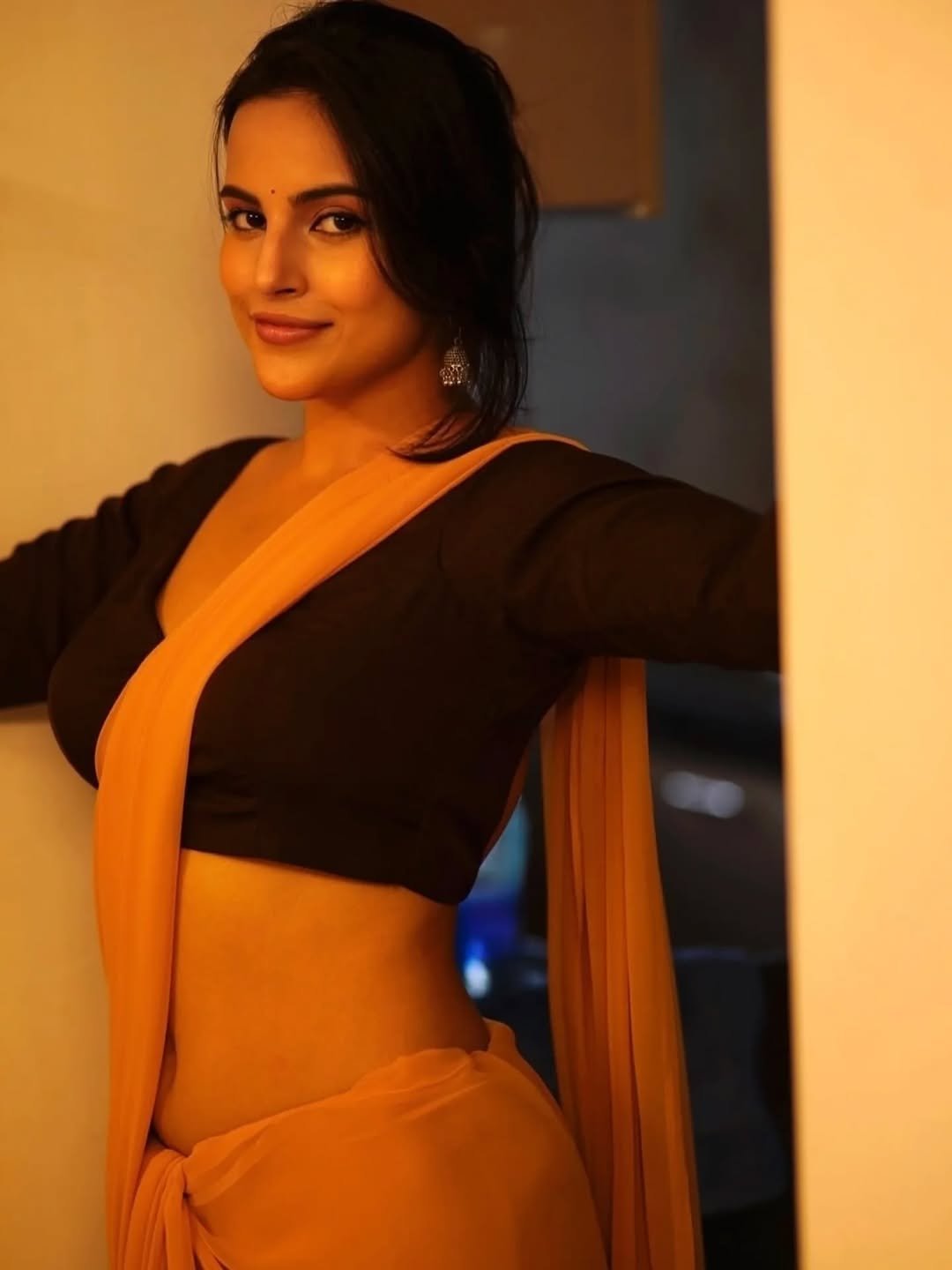 Pratiba Chaudhary in a yellow saree with brown blouse terrace portrait session (15)