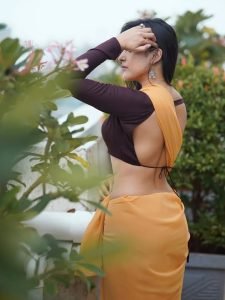 Terrace setting provides natural lighting for Pratiba Chaudhary's yellow saree portrait