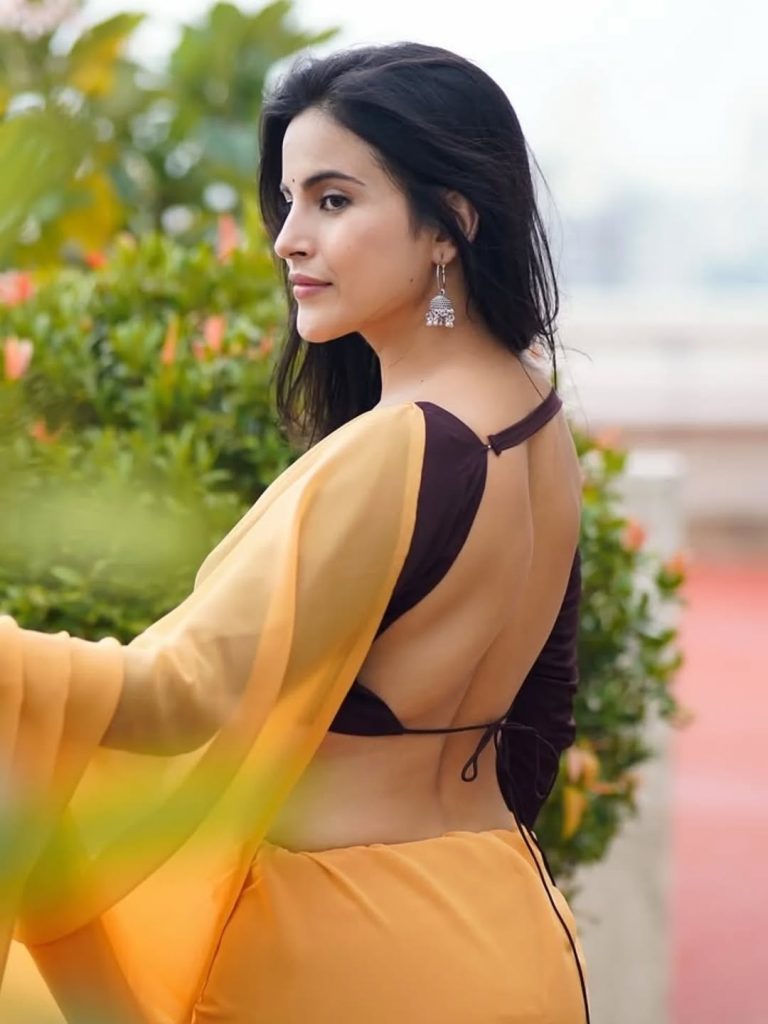 Terrace setting provides natural lighting for Pratiba Chaudhary's yellow saree portrait