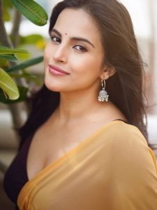 Terrace setting provides natural lighting for Pratiba Chaudhary's yellow saree portrait