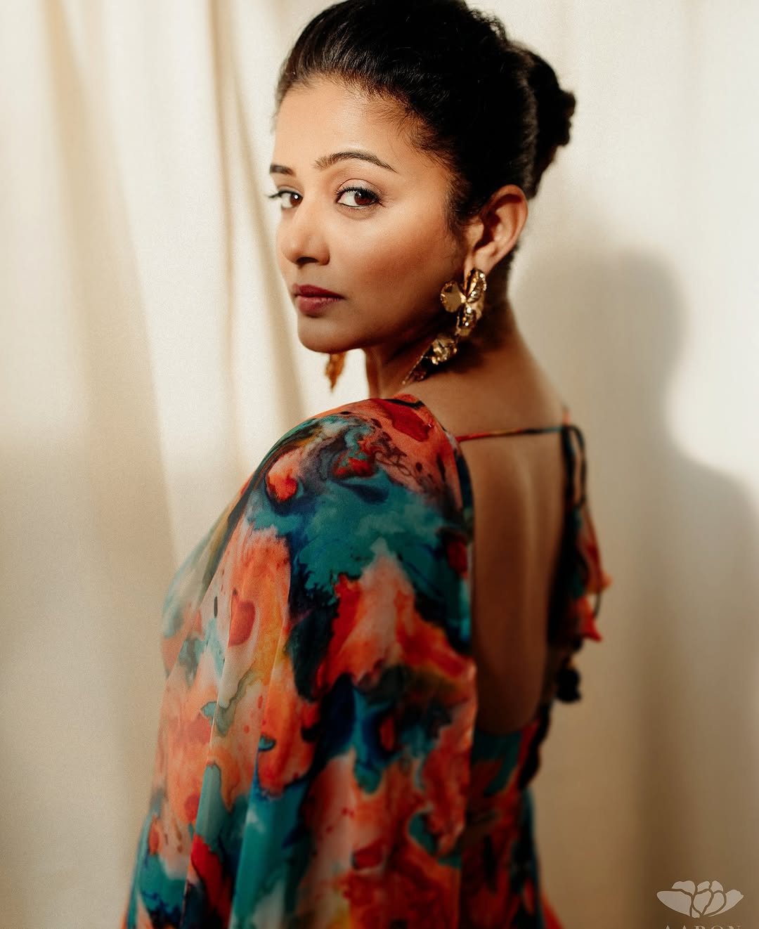 Vibrant multi-color patterns celebrate traditional textile artistry in Priyamani's saree