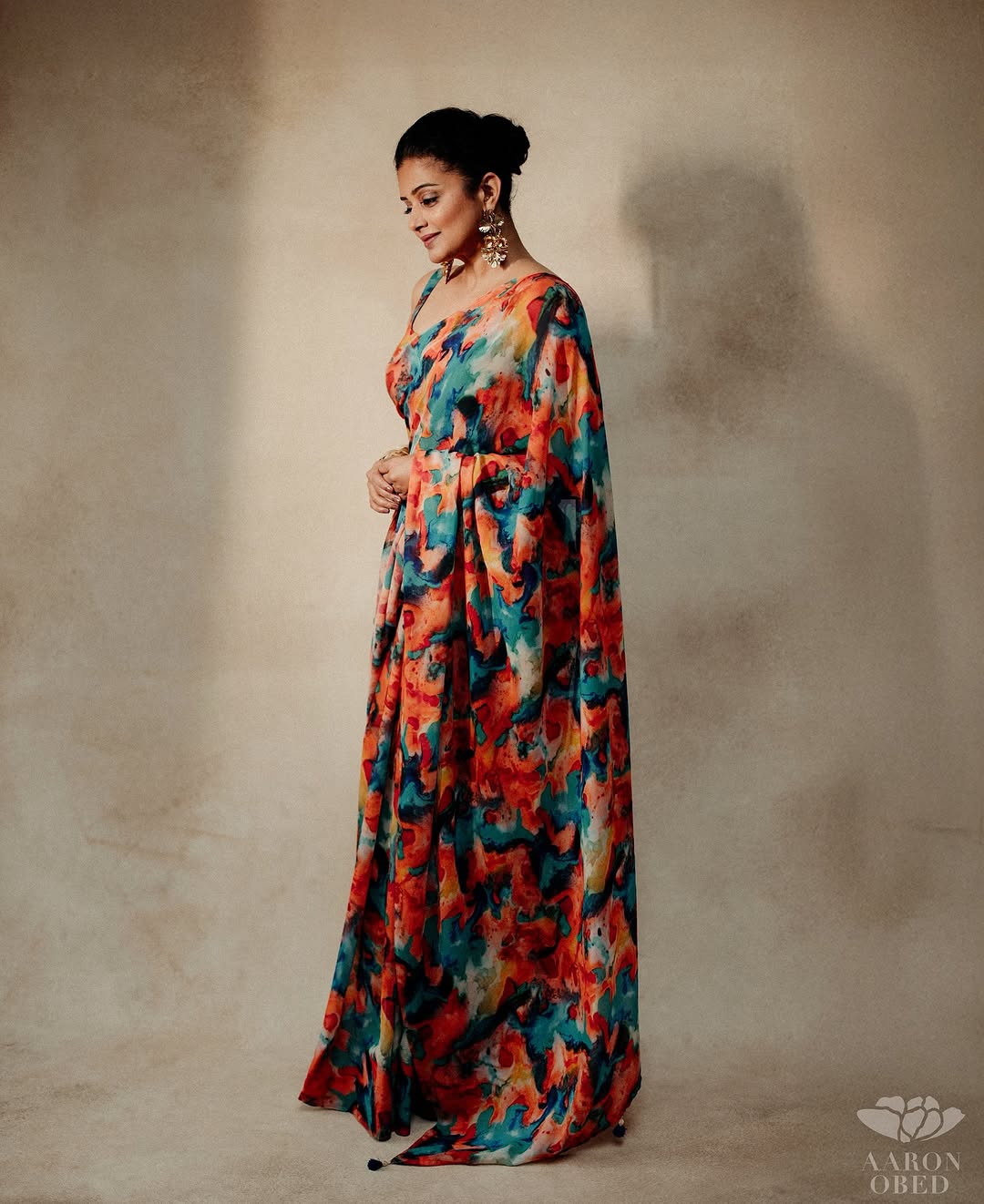 Vibrant multi-color patterns celebrate traditional textile artistry in Priyamani's saree