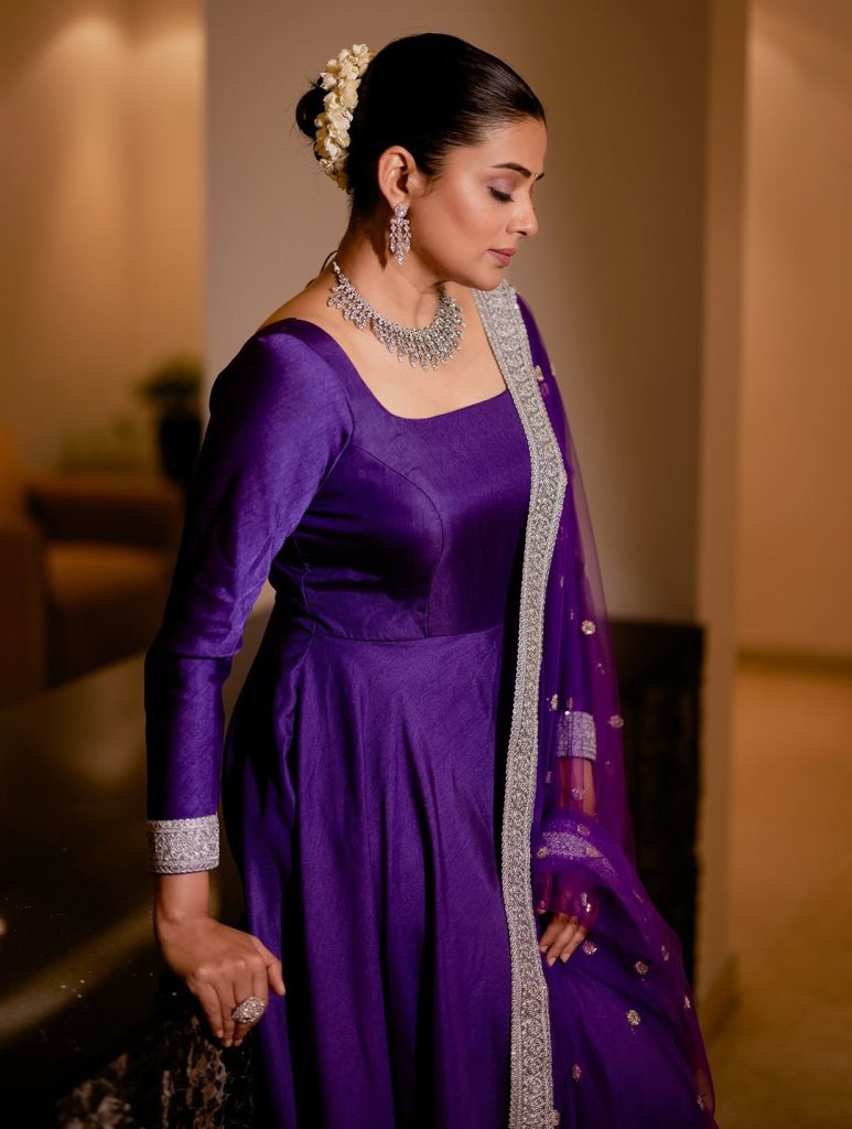 Soft blue traditional wear creates gentle, approachable styling statement for Priyamani