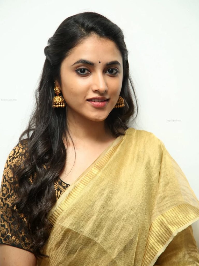 Intimate golden saree closeup captures Priyanka Arul Mohan's traditional elegance