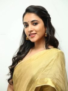Intimate golden saree closeup captures Priyanka Arul Mohan's traditional elegance
