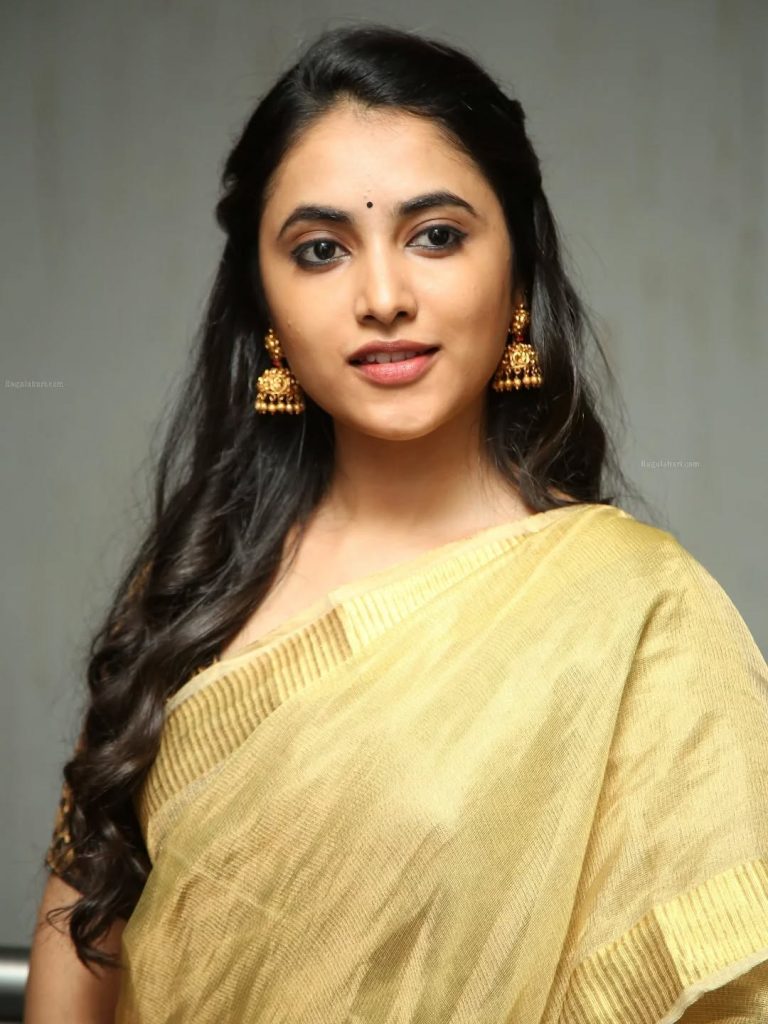 Intimate golden saree closeup captures Priyanka Arul Mohan's traditional elegance