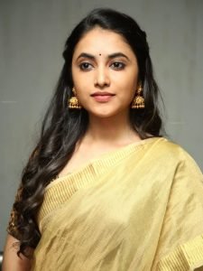 Traditional golden styling showcased through Priyanka Arul Mohan's closeup photography