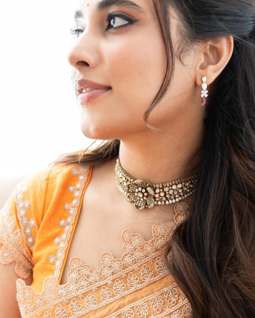 Bold orange traditional wear perfectly suits Priyanka Mohan's vibrant personality