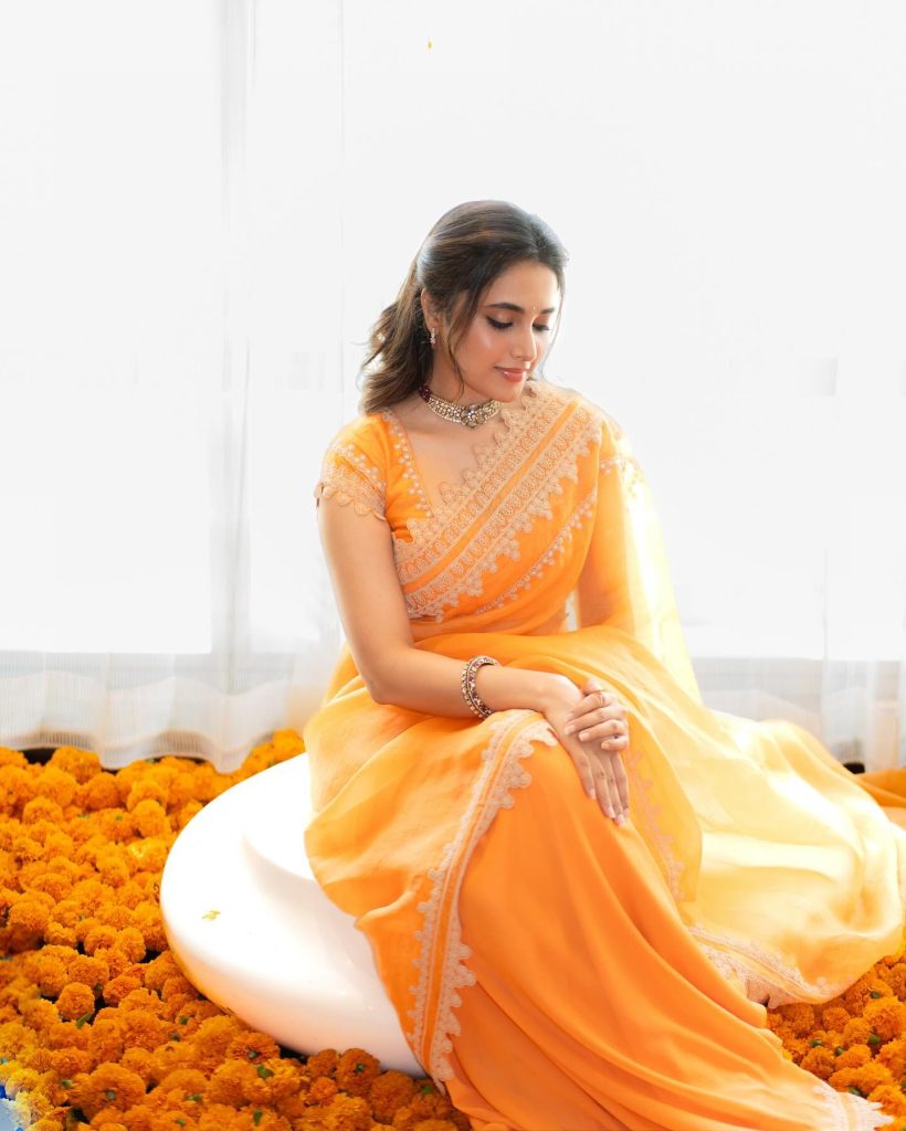 Bold orange traditional wear perfectly suits Priyanka Mohan's vibrant personality