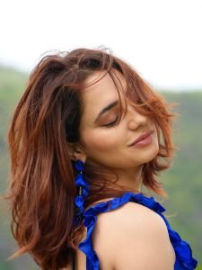 Priyanka Rewri embodies elegance in blue saree with lush greenery surroundings