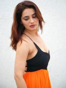 Bold black and orange dress creates striking visual impact for Priyanka Rewri