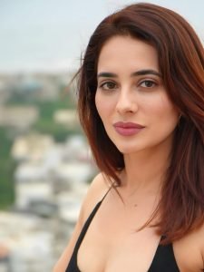 Bold black and orange dress creates striking visual impact for Priyanka Rewri