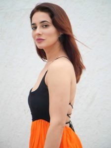 Bold black and orange dress creates striking visual impact for Priyanka Rewri