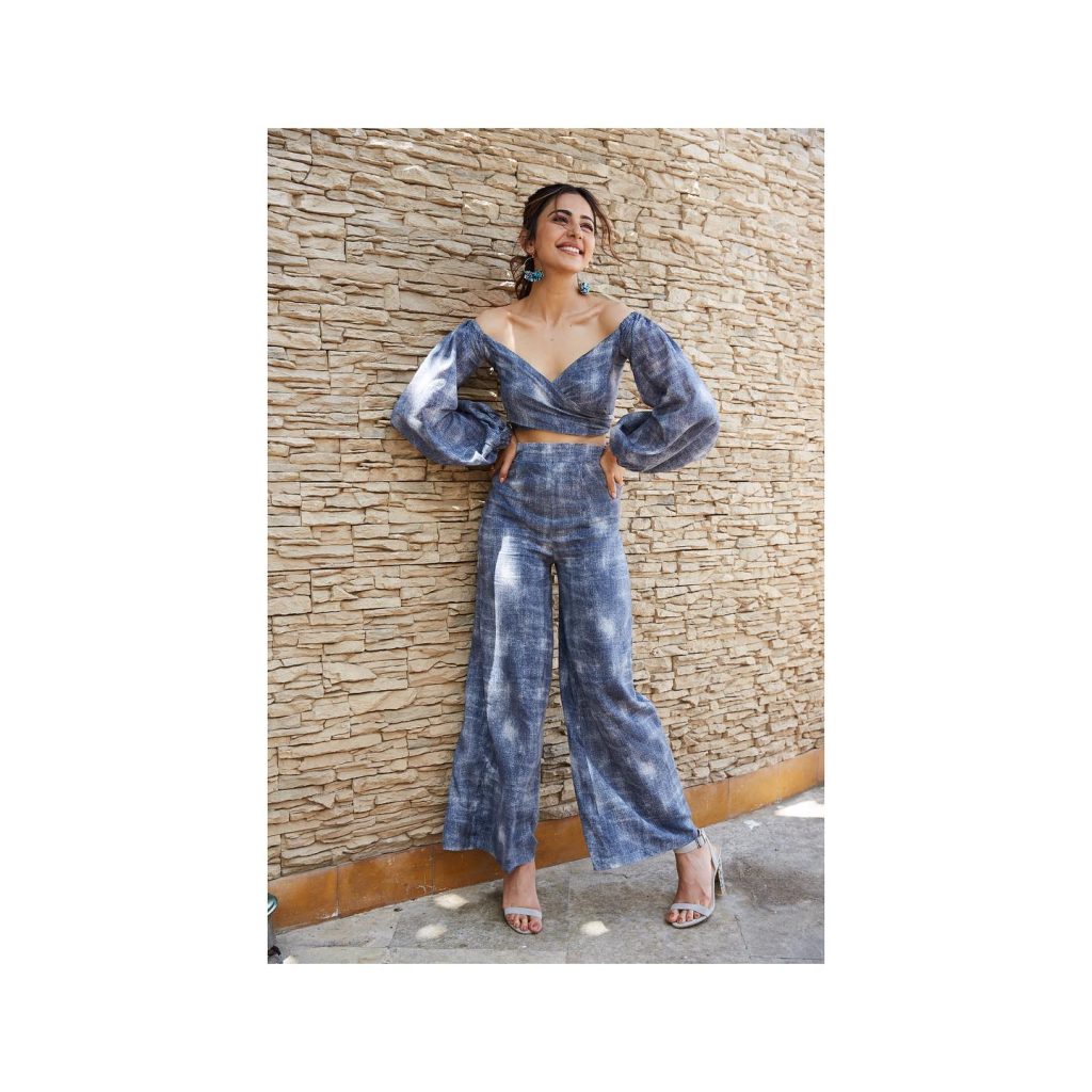 Rakul dazzling in sapphire blue dress with dramatic lighting