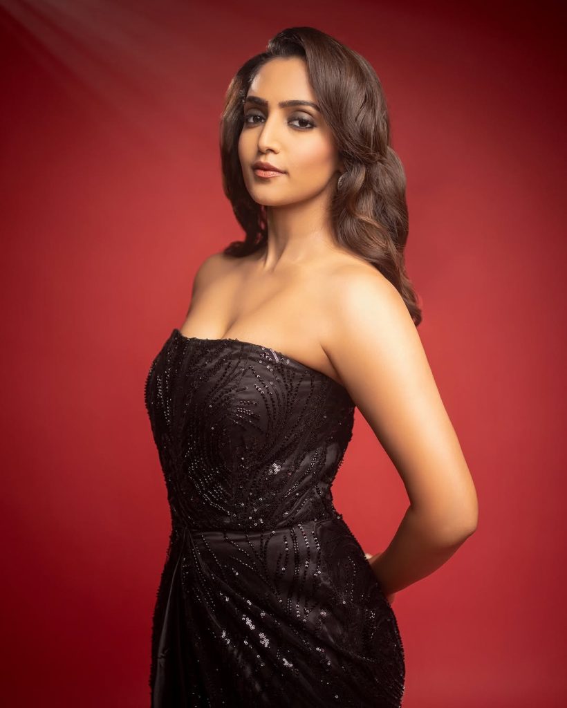 Reba Monica John embodies sophisticated elegance in striking black dress ensemble