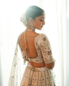 Bridal lehenga styling highlights Reba Monica John's regal presentation